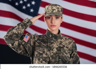 female-american-soldier-saluting-flag-260nw-1846265536.webp