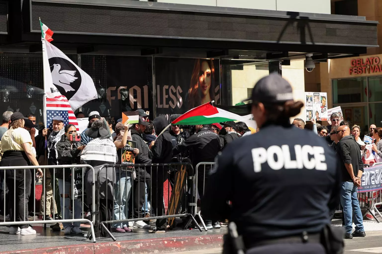 people-hold-palestinian-flags-gather-100685846.webp