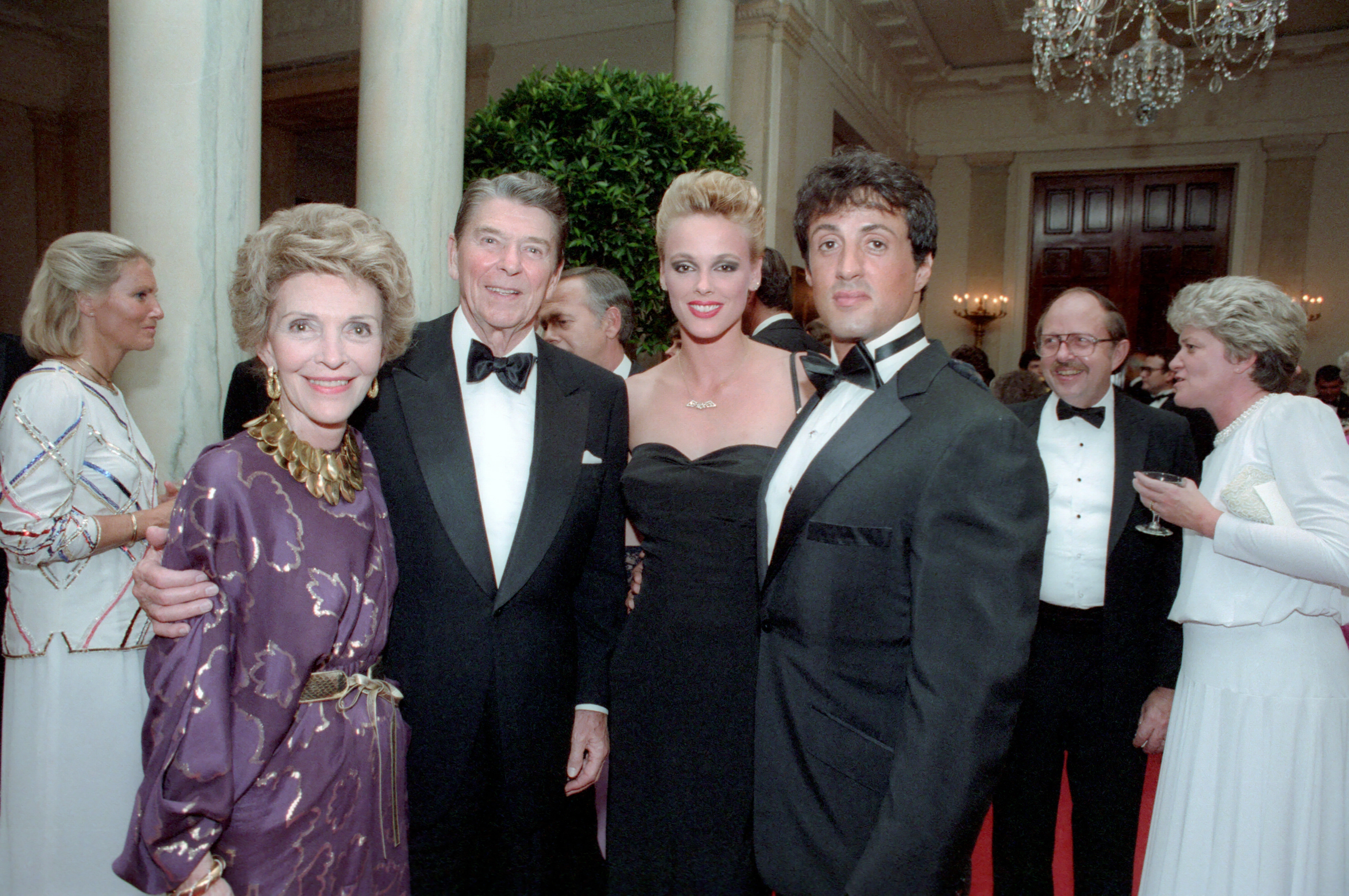 President_Ronald_Reagan_and_Nancy_Reagan_posing_with_Sylvester_Stallone_and_Brigitte_Nielsen.webp